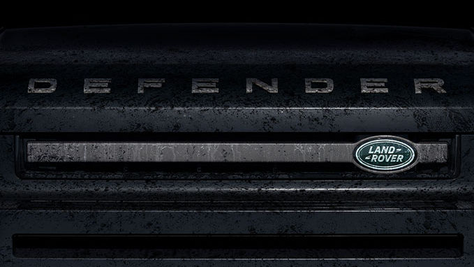 Land Rover Defender name and logo close view 